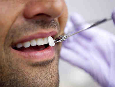 How do I choose a cosmetic dentist?