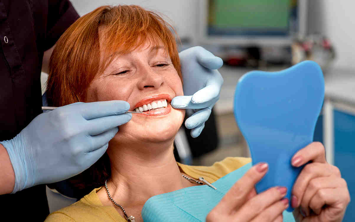 What is the downside of dental implants?