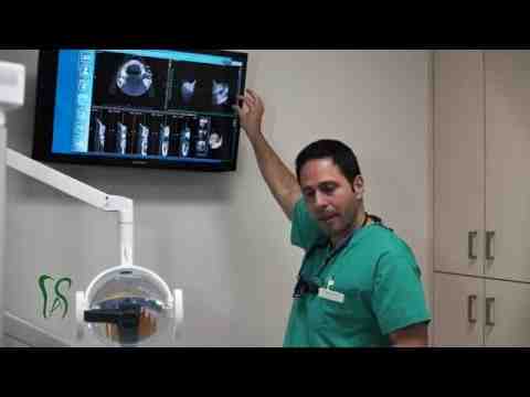 What is the downside of dental implants?