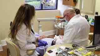 How do I find a reputable cosmetic dentist?