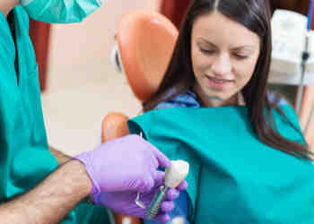 Does it hurt to get a tooth implant?