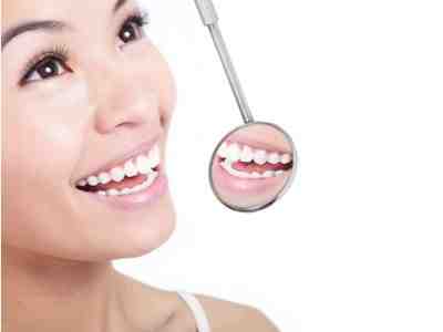 How much does it cost to get your teeth whitened by a dentist?