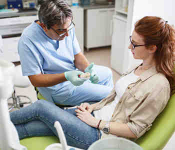 What type of dental service is an implant?