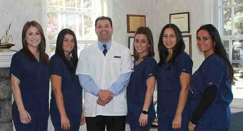 How do I find a reputable cosmetic dentist?