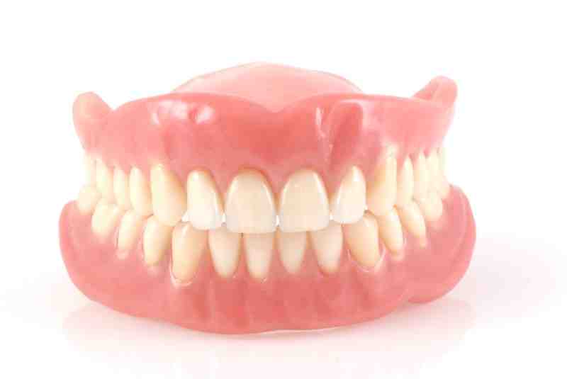 How do you clean fixed dental implants?
