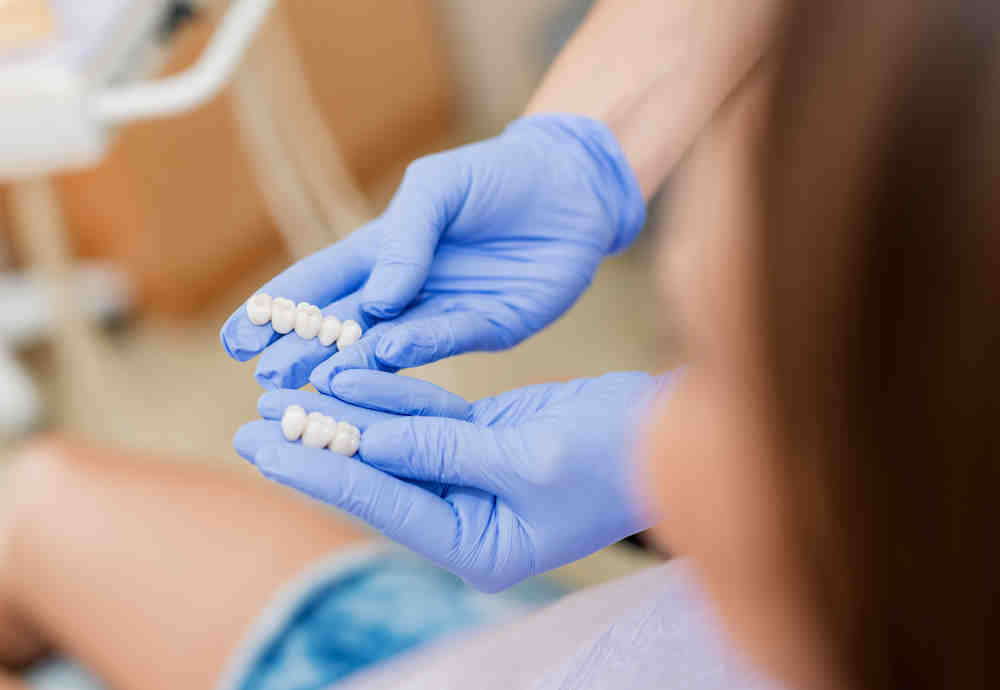 How much does a full set of teeth implants cost?