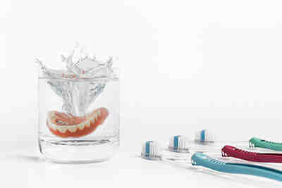 What causes dental implants to fall out?