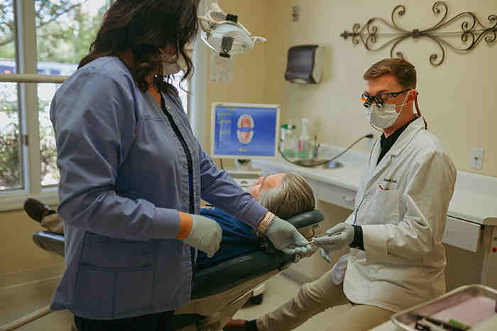 What medications can cause dental implants to fail?