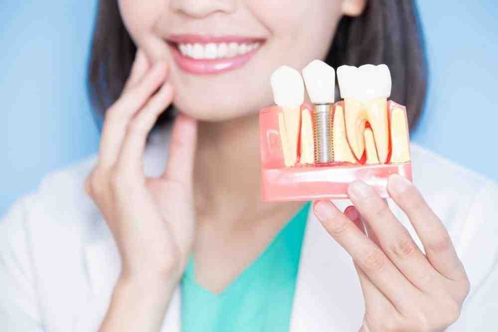 How painful is a tooth extraction for dental implant?