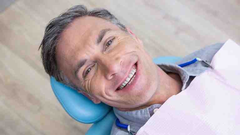 How long are gums sore after implant surgery?