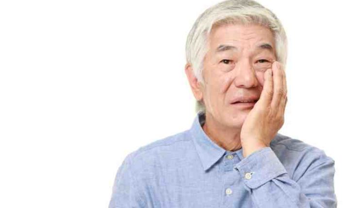 What should you do if a stitch from a dental implant comes loose?