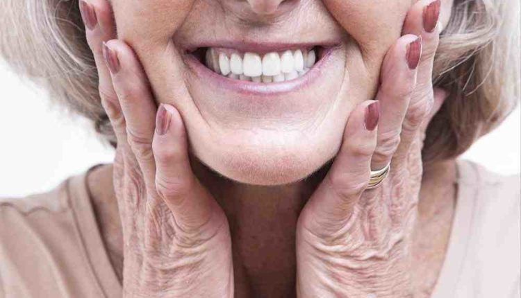 Is it better to have dentures or implants?