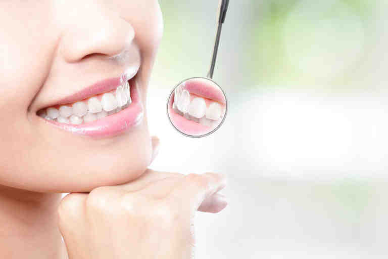What are the pros and cons of veneers?
