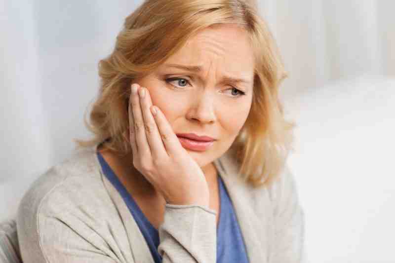 What is the downside of dental implants?
