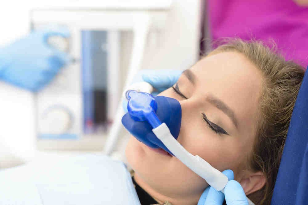 What is the downside of dental implants?